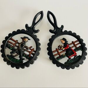 Vintage  Cast Iron Amish Woman and  man Trivets.